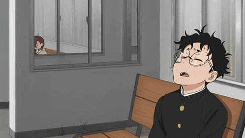 a boy wearing glasses is sitting on a bench with his eyes closed