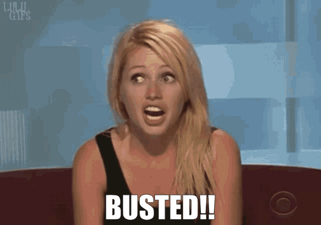 a blonde woman is sitting on a couch with her mouth open and the words busted written on her face