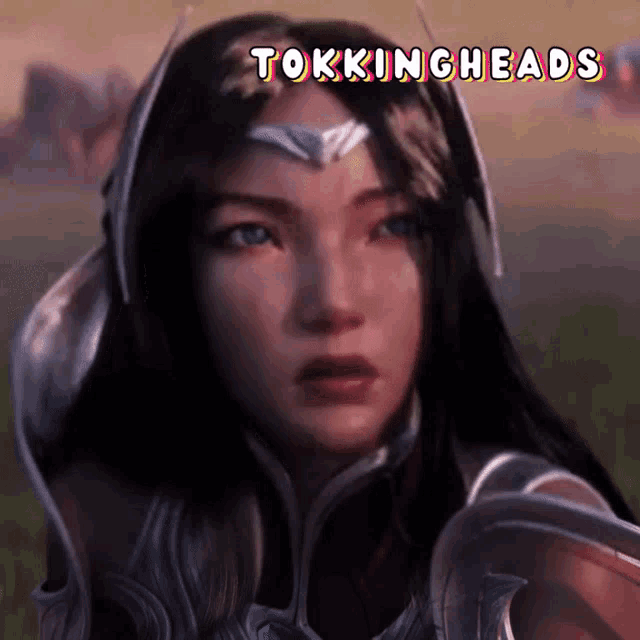 a woman 's face is shown with the words tokingheads below it