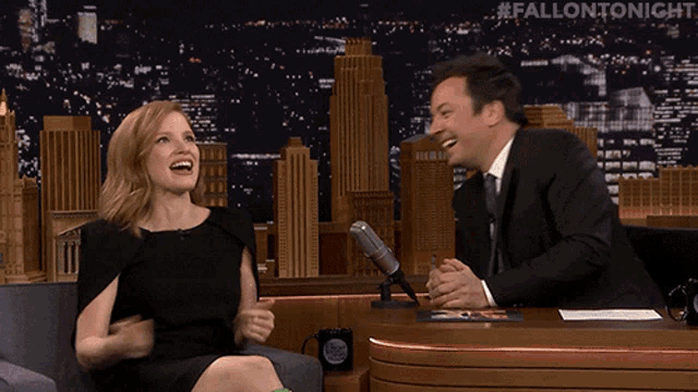 jimmy fallon and jessica chastain are laughing together on fallon tonight
