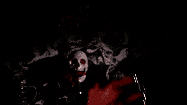 a close up of a person holding a bottle with a skull on it