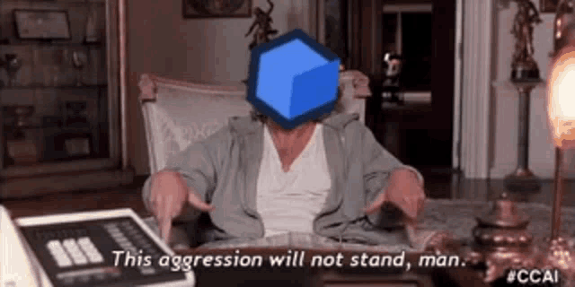 a woman is sitting in a chair with a blue cube in front of her face and pointing at it .