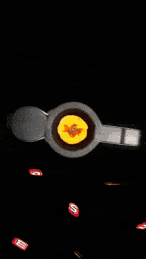 a painting of a circle of fire with a green object in the middle
