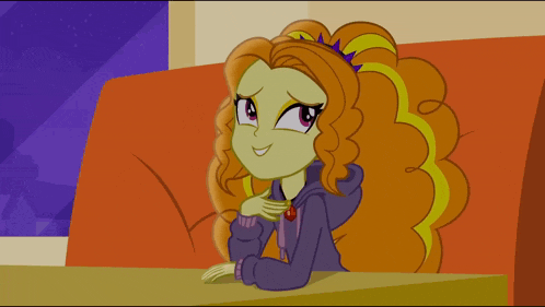 a cartoon girl with orange hair is sitting on a red couch