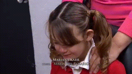 a little girl with the name mariana karr on her back