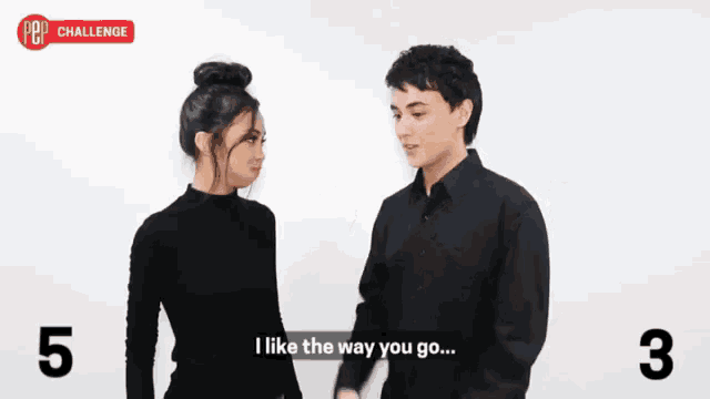 a man and a woman are standing next to each other and the man is saying i like the way you go