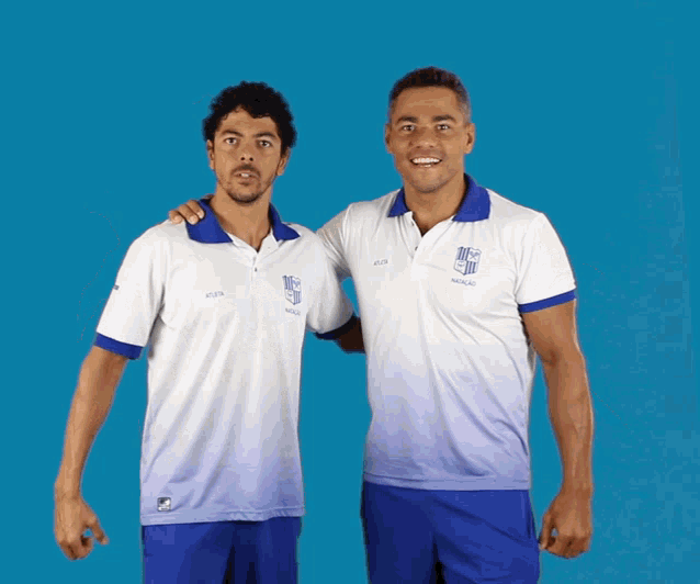 two men are posing for a picture with one wearing a shirt that says ' ufc ' on it