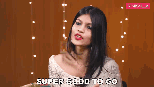 a woman says super good to go in front of pinkvilla