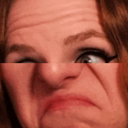 a close up of a woman 's face with her eyes closed .