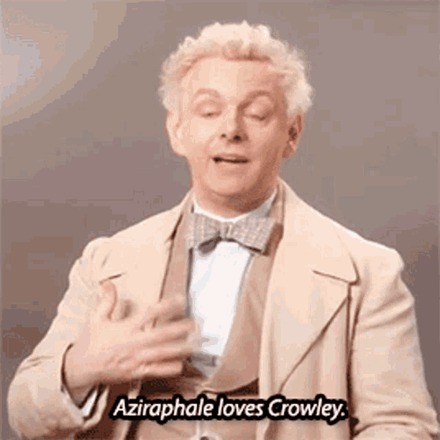 a man in a tan suit and bow tie is talking about crowley