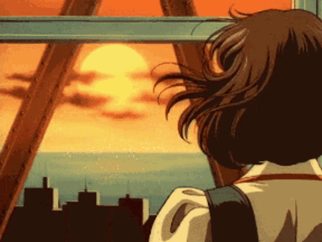 a girl is looking out of a window at the sunset over the ocean