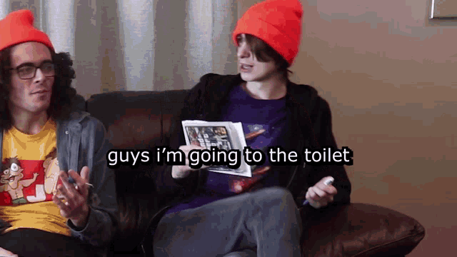 two people sitting on a couch with the words " guys i 'm going to the toilet " above them