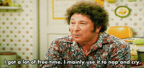 a man in a floral shirt says " i got a lot of free time i mainly use it to nap and cry "