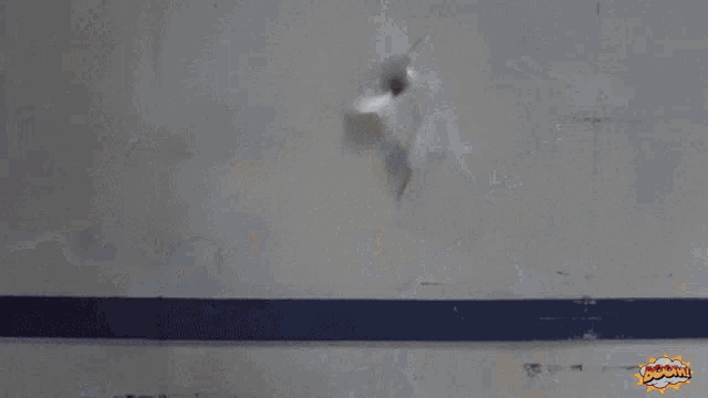a smoke filled room with a sign that says " boom " on it