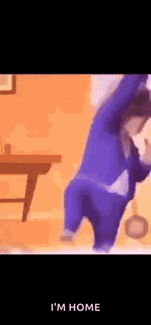 a cartoon character is standing in a room with his arms in the air .