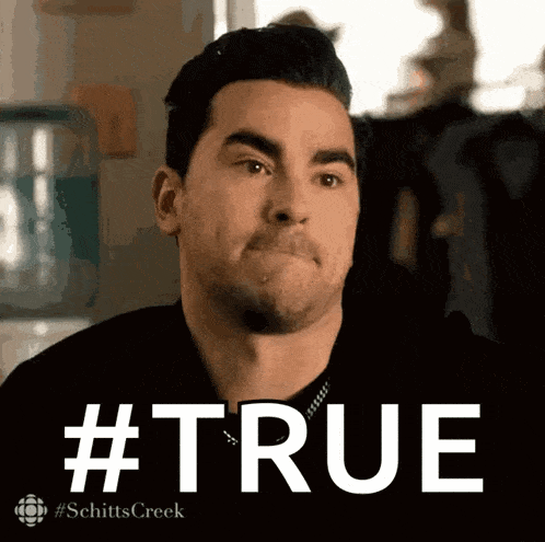 a man in a black shirt is making a funny face and the words #true are behind him