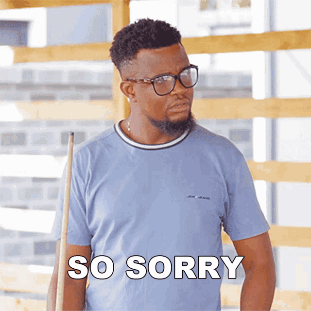 a man holding a pool cue with the words so sorry below him