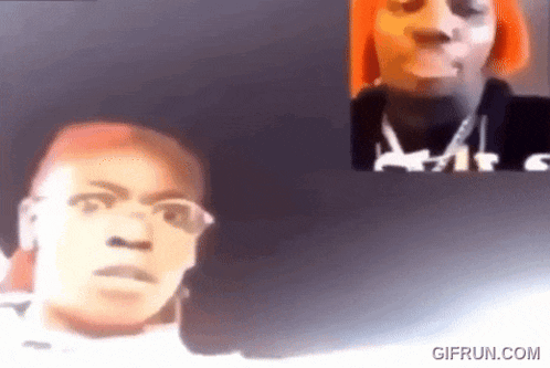 a man and a woman are having a video call and the woman is wearing orange hair .