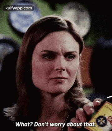 a woman is holding a can of something and says `` what ? don 't worry about that . ''