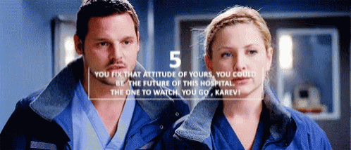 a man and a woman standing next to each other with the number 5 on the bottom right