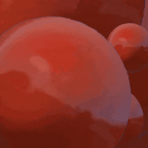a bunch of red balloons floating in the air