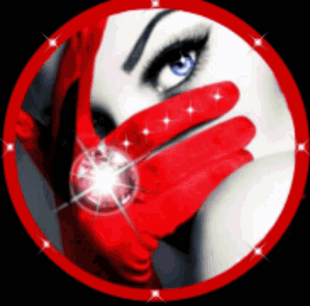 a woman in a red glove is holding a diamond