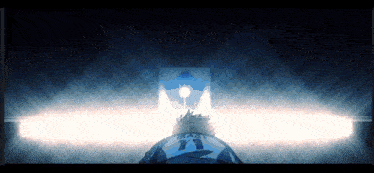 a person with the number 11 on their back stands in a dark room