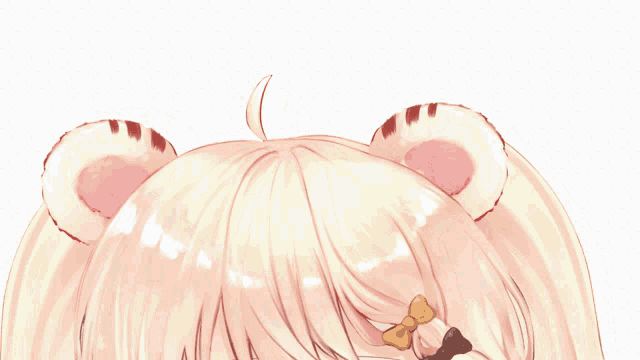 a close up of a girl 's hair with bear ears and a bow