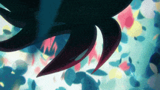 a close up of a colorful background with a black object