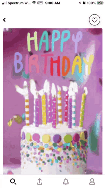a phone screen shows a birthday cake with candles and the words happy birthday on it