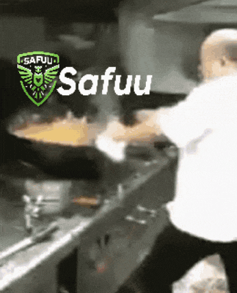 a man is cooking in a kitchen with the words safuu on the bottom right