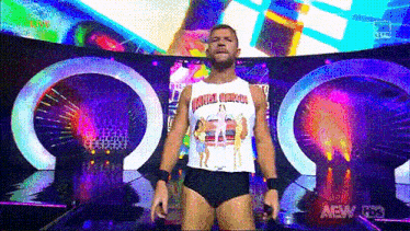 a wrestler wearing a tank top that says ' incredibles ' on it