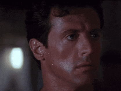 a close up of a man 's face with sweat coming out of his face