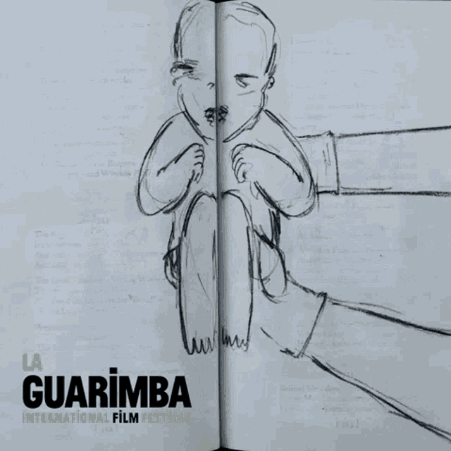 a book is open to a page with a drawing of a woman holding a baby and the words guarimba international film festival