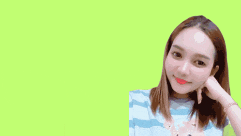a girl is standing in front of the word gai