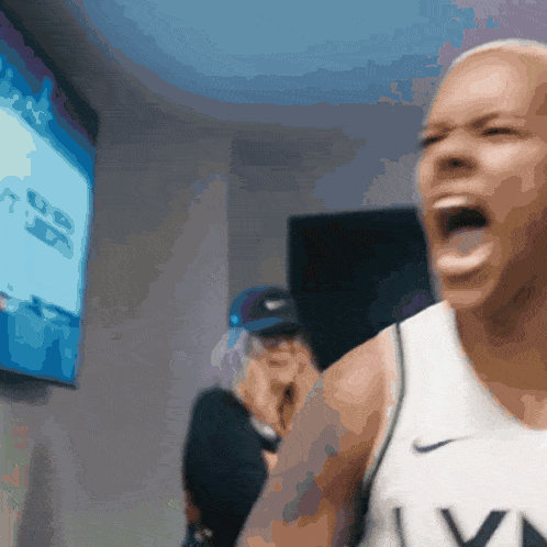 a man wearing a nike jersey is screaming with his mouth open