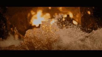 a close up of a waterfall with a blurred background