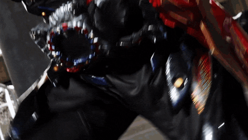 a blurred image of a shark 's mouth with a red white and blue teeth