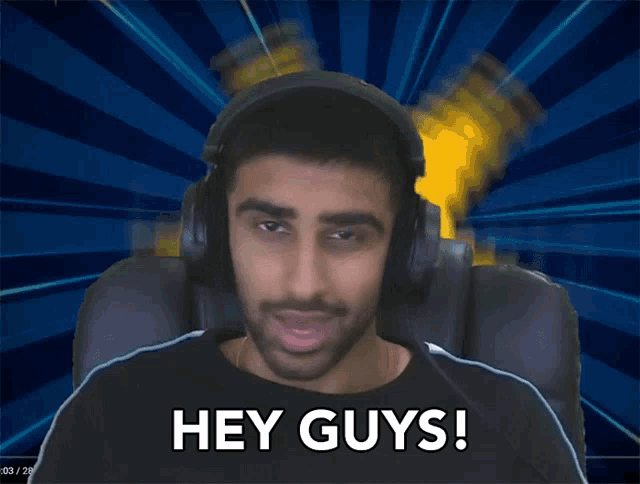 a man wearing headphones says " hey guys "