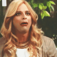 a woman with blonde hair is making a funny face