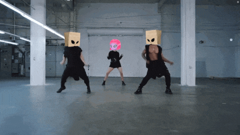 a group of people wearing cardboard boxes on their heads