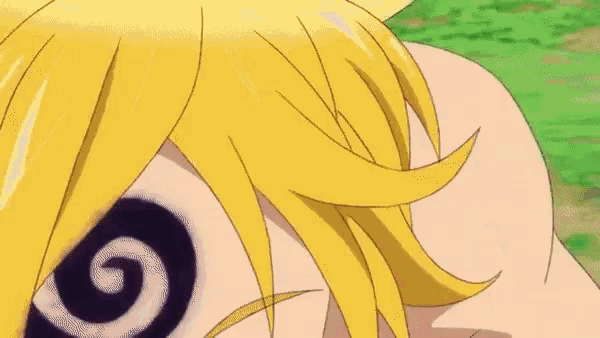 a close up of a person 's face with yellow hair and a black and white tattoo on it .