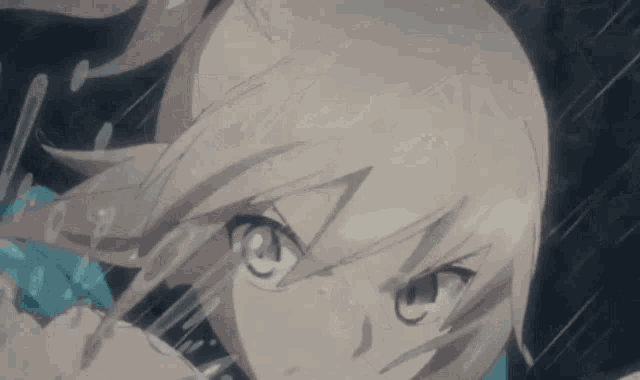 a close up of a girl 's face with water coming out of her mouth .