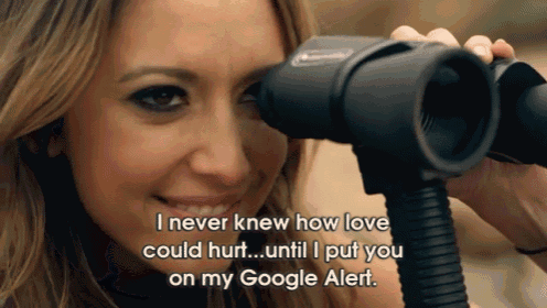 a woman looking through a binoculars with the words i never knew how love could hurt