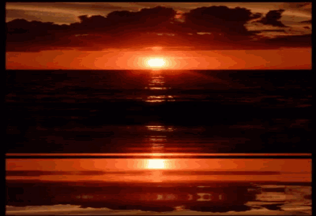 the sun is setting over the ocean and the letters i and j are reflected in the water