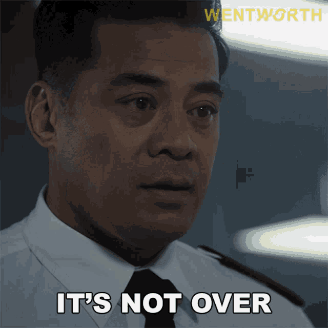 a man in a uniform says it 's not over in front of a wentworth logo