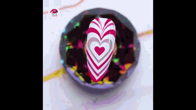 a nail with a heart design on it