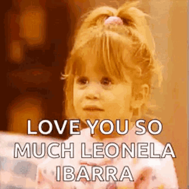 a little girl is sitting on a couch with the words `` love you so much leonela ibarra '' written on her face .