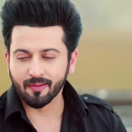 a man with a beard wearing a black shirt is making a funny face