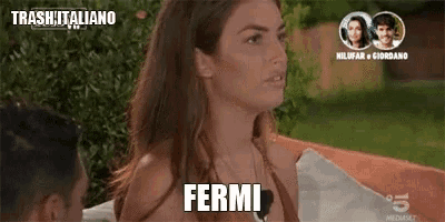 a woman in a bathing suit says " fermi " in front of a man